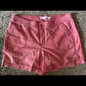 Distressed/faded red shorts